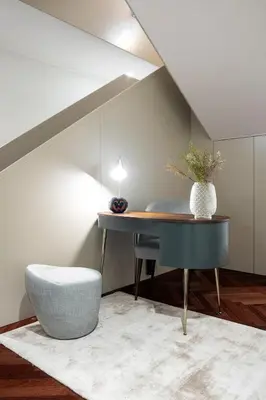 a room with a table and a chair and a vase at Trindade Premium Apartments in Porto