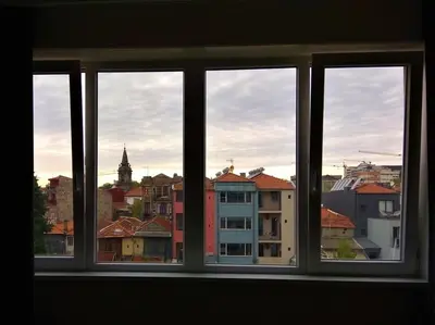 a window with a view of a city at Chez Moi Bolhão in Porto
