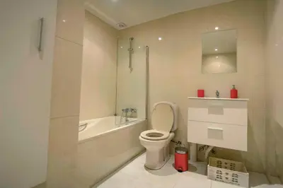 a bathroom with a toilet and a sink and a shower at Vivenda Center Porto in Porto