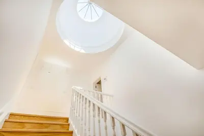 a white living room with white furniture and a flat screen tv at Santa Catarina Charming Loft in Porto
