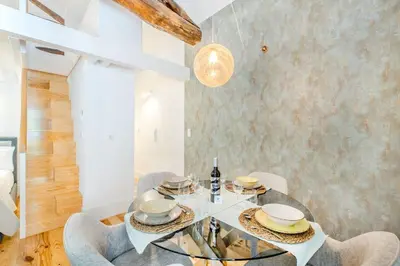 a driftwood sculpture hangs from the ceiling of a room at Santa Catarina Charming Loft in Porto