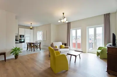 a living room with a couch and a table at Estrela de Gaia Apartments in Vila Nova de Gaia