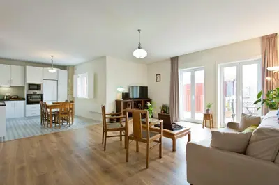 a living room with a couch and a table at Estrela de Gaia Apartments in Vila Nova de Gaia