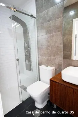 a bathroom with a shower and a toilet and a sink at Santa Catarina Guest House (Porto city center) in Porto