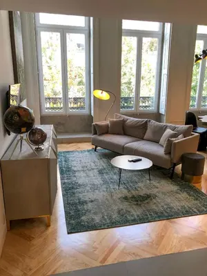 a living room with a couch and a rug at Oporto Chic&Cozy - Ateneu in Porto