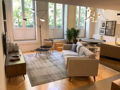 a living room with a couch and a table at Oporto Chic&Cozy - Ateneu in Porto
