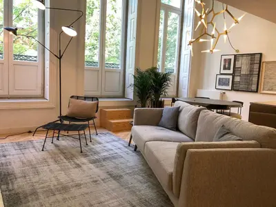 a living room with a couch and a table at Oporto Chic&Cozy - Ateneu in Porto