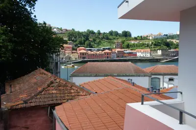 a view of a city from the roof of a building at Alfandega Apartments in Porto