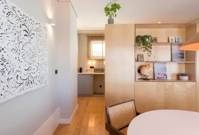 a dining room with a white table and chairs at Ceuta 33 Apartment in Porto