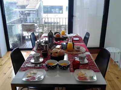 a table with breakfast food on top of it at Casa 45 Porto in Porto