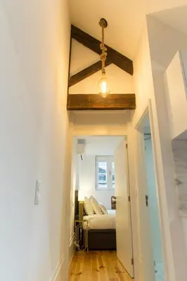 a room with a bed and a ceiling at Loft da Sé by Porto City Hosts in Porto