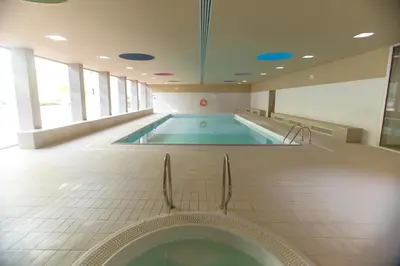 a large swimming pool in a building at Afurada premium apartment by Porto City Hosts in Vila Nova de Gaia