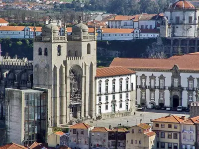 a large building with a clock tower in a city at ! Free Parking Street ! Ground Floor with Washer! in Porto