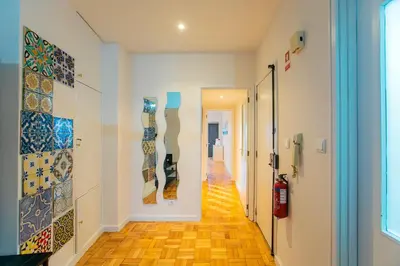 a hallway with colorful tiles on the walls at Casa da Alegria- Downtown by Oporto Soul in Porto