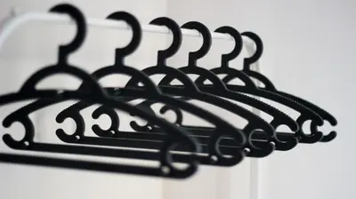 a black metal sign hanging on a wall at Silva's Guest House in Vila Nova de Gaia