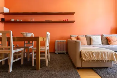 a living room with a couch and a dining room table at Porto by the River 1 in Porto