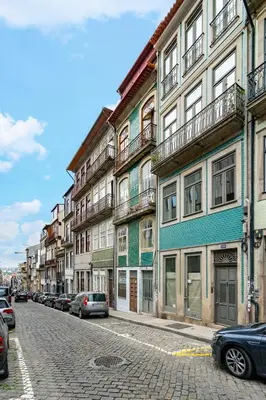 a city street with cars parked in front of buildings at Luxury Old Town Oasis for Family and Friends (Daily Breakfast + Housekeeping incl) in Porto