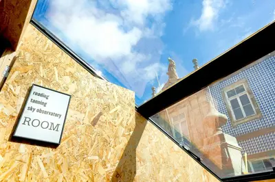 a window of a building with a sign on it at Porto National Theatre Trendy Houses in Porto