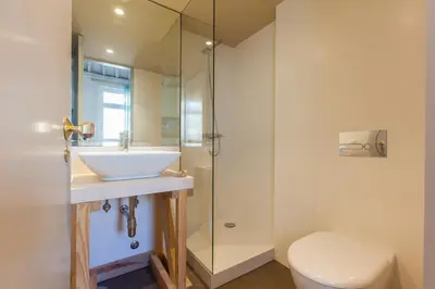a bathroom with a sink and a shower at The Art Porto - Holiday Homes in Porto