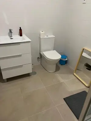 a bathroom with a toilet and a sink at 26/3 Casa da Música in Porto