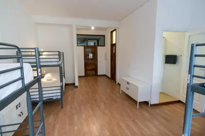 a dorm room with bunk beds and a hallway at Change The World Hostels - Porto - Santa Catarina in Porto