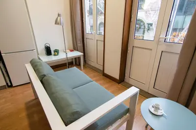 a living room with a couch and a table at Change The World Hostels - Porto - Santa Catarina in Porto