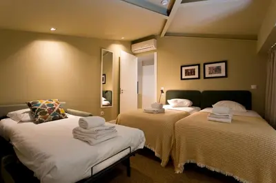 a room with two beds with towels on them at RVA - Porto Central Flats in Porto