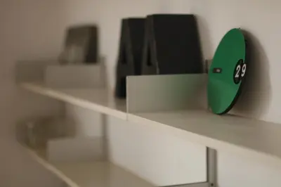a green item sitting on top of a shelf at Alegria 1º in Porto