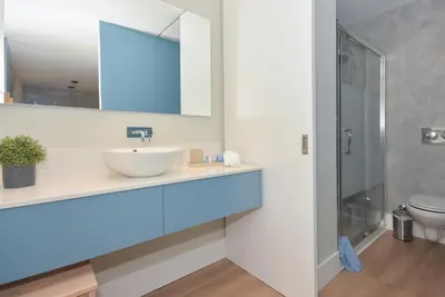 a bathroom with a sink and a mirror at Invicta Oporto Residence in Porto