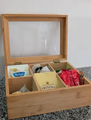 a wooden box filled with items in a room at House, view of Bolhão market in Porto