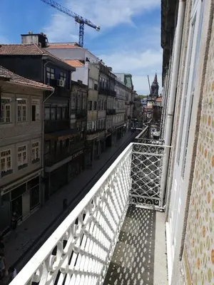 a view of a city street from a balcony at House, view of Bolhão market in Porto
