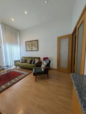 a living room with a couch and a table at House, view of Bolhão market in Porto