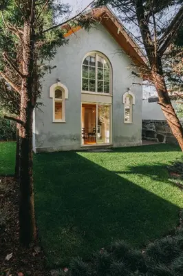 a house with a large window and green grass at Oporto Maison Palace in Porto