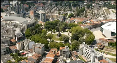 an aerial view of a city with buildings and trees at Invictus Porto Apartment in Porto