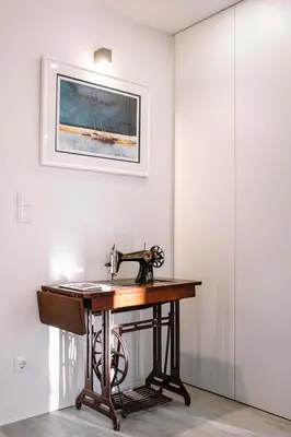 a sewing machine sitting on a table in a room at BBA Apartments Palácio I - Douro View, Gym & Free Parking in Porto