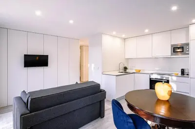 a living room with a couch and a table at BBA Apartments Palácio I - Douro View, Gym & Free Parking in Porto
