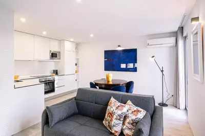 a living room with a couch and a table at BBA Apartments Palácio I - Douro View, Gym & Free Parking in Porto
