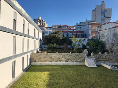 a view from the side of a building with a retaining wall at BBA Apartments Palácio II - Garden View, Gym & Free Parking in Porto