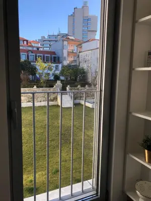 a window with a view of the city at BBA Apartments Palácio II - Garden View, Gym & Free Parking in Porto