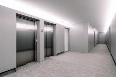 a row of elevators in an office building at BBA Apartments Palácio II - Garden View, Gym & Free Parking in Porto