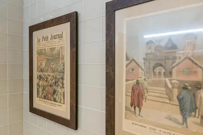 a picture hanging on a wall with a painting on it at GuestReady - Cardosas Town Apartment in Porto
