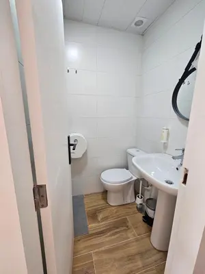 a small room with a bed and a table at Porto Automatic in Porto