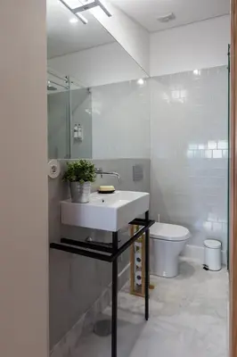 a bathroom with a sink and a toilet at Beautiful Loft Downtown Porto in Porto