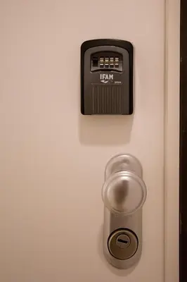 a clock on a door with a temperature gauge at Porto City Cottage in Ribeira neighborhood in Porto