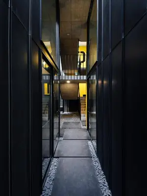 a hallway of a building with a stone wall at Breiner 310 Downtown Porto Boutique Apartments in Porto