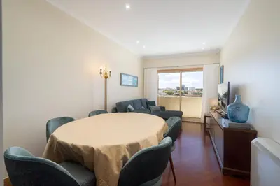 a living room with a table and chairs at Host Wise - Anna Flats in Vila Nova de Gaia