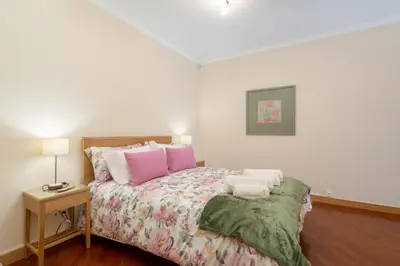a bedroom with a bed with two pillows on it at Host Wise - Anna Flats in Vila Nova de Gaia