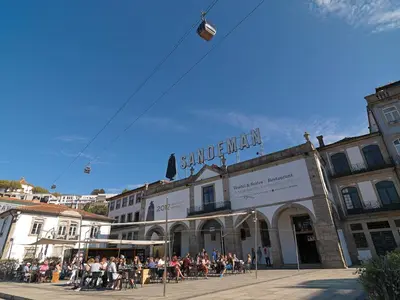 a group of people sitting outside of a building at FLH Oporto Wine Cellars Luxury Apartment II in Vila Nova de Gaia