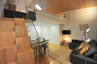 a living room with a couch and a table in a room at FLH Oporto Wine Cellars Luxury Apartment II in Vila Nova de Gaia