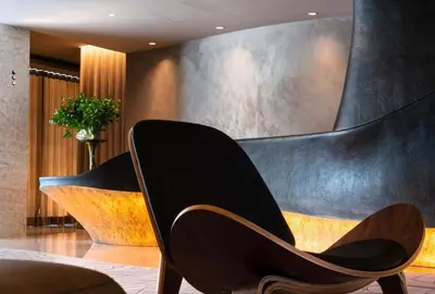 two chairs in a room with a wall at BessaHotel Baixa in Porto